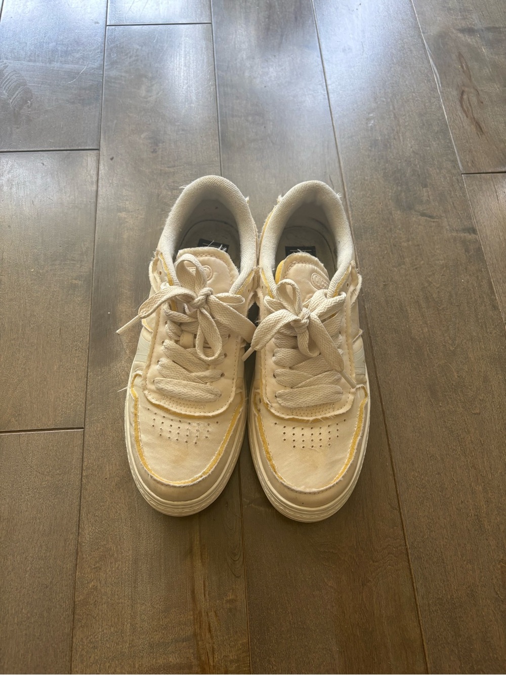 Lacoste for women 
Neutral Canvas Sneakers with Yellow Trim